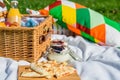 Picnic Basket With Fruits, Orange Juice, Croissants, Quesadilla And No Bake Blueberry And Strawberry Cheesecake Royalty Free Stock Photo