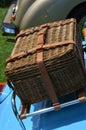 Picnic basket on rear of classic car. Royalty Free Stock Photo