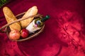 Picnic basket on the red blanket top view. Apples, white wine an