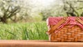 Picnic basket on a table against the background of nature. Rest and summer mood. Departure for a picnic on the weekend or vacation Royalty Free Stock Photo