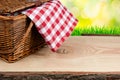 Picnic basket on the table with checked clothe Royalty Free Stock Photo