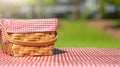 Picnic basket on a table with a red tablecloth. Summer mood. relaxation. holidays