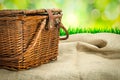 Picnic basket on the table with sack cloth Royalty Free Stock Photo