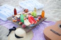 Picnic on the beach at sunset in the style boho, food and drink conception Royalty Free Stock Photo