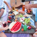 Picnic on the beach at sunset in the style boho, food and drink conception Royalty Free Stock Photo