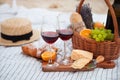 Picnic on the beach at sunset in the white plaid, food and drink