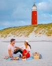Picnic on the beach Texel Netherlands, couple having picnic on the beach of Texel