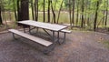 Empty picnic bench near a body of water Royalty Free Stock Photo