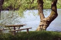 Picnic bench by river Royalty Free Stock Photo