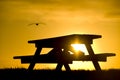 Picnic Bench Silhouetted Against Sunset