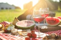 Picnic blanket with delicious food and drinks outdoors on sunny day, closeup Royalty Free Stock Photo