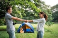 Picnic and Camping time. Young couple having fun in the moment of love in the park. Love and tenderness, Romantic man playing Royalty Free Stock Photo