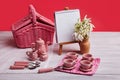 Picnic card with table setting and snowdrops, small essel with blank note pad, silverware, pink and white checkered napkin