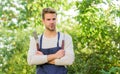 Picnic concept. Bbq chef. Summer weekend. Tools for roasting meat outdoors. Barbeque party. Handsome guy cooking food Royalty Free Stock Photo