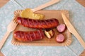 Picnic cutlery and grilled sausage on a paper plate. Recycling and plastic free world concept Royalty Free Stock Photo