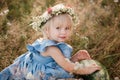 picnic with family. cute little girl with big watermelon in summertime in the park. Adorable child wearing in flowers