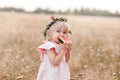 picnic with family. cute little girl eating big piece of watermelon on the grass in summertime in the park. Adorable