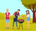 Picnic in forest or park. Happy friends cooking food outdoors. People having fun, relaxing in nature