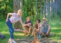 Picnic with friends in forest near bonfire. Company friends having hike picnic nature background. Hikers relaxing during Royalty Free Stock Photo