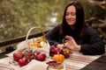 picnic by the lake, young woman, fruits, pie and pumpkins