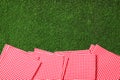 Picnic napkins on grass. Space for text Royalty Free Stock Photo