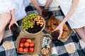 Picnic in nature, croissants, peaches, grapes, cherries, cheese, hazelnuts