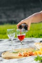 picnic in nature a light meal under wine, on a wooden background two glasses of red wine Royalty Free Stock Photo
