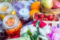 Picnic in the outdoor with strawberry, apples, pillows and cold Royalty Free Stock Photo