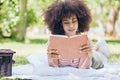 Picnic, park and reading black woman with book relax for outdoor education, studying and wellness. Black woman notebook Royalty Free Stock Photo