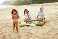 Picnic. Portrait Of Family On Beach Having Lunch. Mother With Kids Enjoying Weekend At Tropical Ocean. Royalty Free Stock Photo