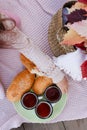 picnic puff buns and mugs with tea. Outdoor food