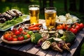 picnic scene with pilsner beer and array of grilled veggies Royalty Free Stock Photo