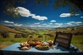 picnic setting with view of rolling hills and clear blue sky