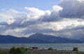 Picnic site on the bay with storm clouds Royalty Free Stock Photo