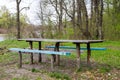 Picnic site wooden table and benches in forest park Royalty Free Stock Photo