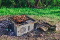 A picnic with a fire and a grill in the old computer case Royalty Free Stock Photo