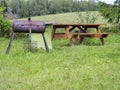 Picnic table and BBQ pit at a forest campsite in Oregon Royalty Free Stock Photo