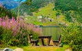 Picnic table and benches near lake in Norway, Europe. Royalty Free Stock Photo