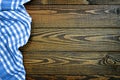 Picnic table cloth on wooden background