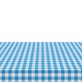 The picnic table is covered with a checkered tablecloth. White blue gingham textile. Clean surface with textile Royalty Free Stock Photo