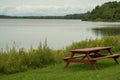 Pinic table on the lakeshore Royalty Free Stock Photo