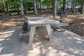 Picnic table and a grill in a park Royalty Free Stock Photo