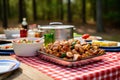 picnic table loaded with alabama chicken for a family outing