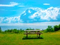 Picnic table overlooking JÃ¦gerspris Bugt in JÃ¦gerspris, Denmark Royalty Free Stock Photo