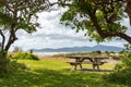 Picnic table at the Pacific coast in Queen Elisabeth Park, New Zealand