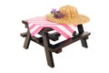 Picnic table with straw summer hat