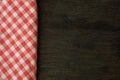 Picnic tablecloth on old wooden table top view Royalty Free Stock Photo