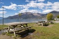 Picnic tables on a beach of Lake Como Royalty Free Stock Photo