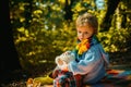 Picnic with teddy bear. Hiking with favorite toy. I will show you beauty of nature. Inseparable with toy. Boy cute child Royalty Free Stock Photo