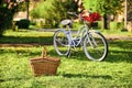 Picnic time. Nature cycling tour. Retro bicycle with picnic basket. Bike rental shops primarily serve typically Royalty Free Stock Photo